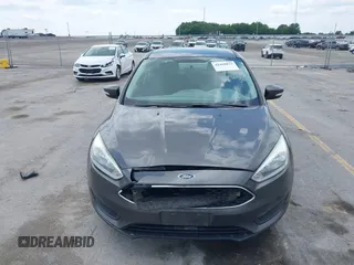 2016 Ford Focus SE z VIN 1FADP3F2XGL298174, wystawiony jako IAAI lot #42468032 z przebiegiem 236 803 mil mil oraz . Historia ofert i sprzedaży dostępna na DreamBid. Obrazek 6.