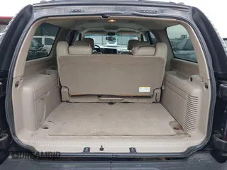 2004 Chevrolet Suburban LT z VIN 1GNFK16ZX4J291419, wystawiony jako IAAI lot #42163331 z przebiegiem 235 054 mil mil oraz . Historia ofert i sprzedaży dostępna na DreamBid. Obrazek 17.