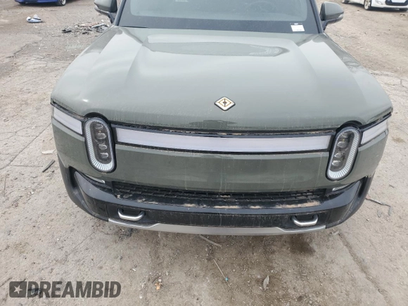 2022 Rivian R1T Launch Edition z VIN 7FCTGAAL2NN000433, wystawiony jako Copart lot #46680705 z przebiegiem Nie podano mil oraz Szkody całkowita. Historia ofert i sprzedaży dostępna na DreamBid. Obrazek 11.
