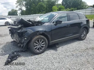 2021 Mazda CX-9 Touring z VIN JM3TCBCY1M0502319, wystawiony jako Copart lot #56214825 z przebiegiem Nie podano mil oraz Szkoda całkowita • Salvage title. Historia ofert i sprzedaży dostępna na DreamBid. Obrazek 1.