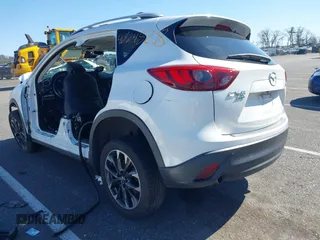 2016 Mazda CX-5 Grand Touring with VIN JM3KE4DY9G0706192, listed as a IAAI auction lot 41824828 with Not Provided miles and . Bid and sale history available at DreamBid. Image 3.