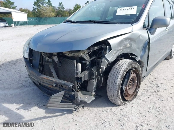 2010 Nissan Versa 1.8 S with VIN 3N1BC1CP9AL385466, listed as a IAAI auction lot 41884324 with 140,753 mi miles. Bid and sale history available at carsss.com. Image 6.
