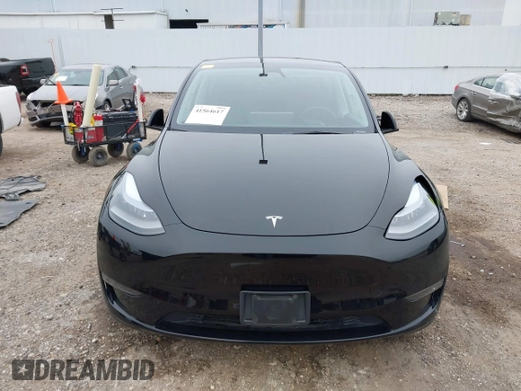 2023 Tesla Model Y Long Range z VIN 7SAYGDEEXPA181114, wystawiony jako IAAI lot #41564617 z przebiegiem 64 990 mil mil oraz . Historia ofert i sprzedaży dostępna na DreamBid. Obrazek 13.