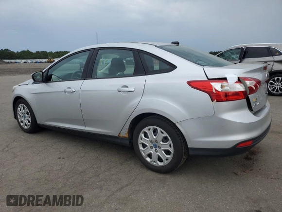 2012 Ford Focus SE with VIN 1FAHP3F2XCL202510, listed as a Copart auction lot 64066545 with 77,828 mi miles and Salvage title. Bid and sale history available at DreamBid. Image 2.