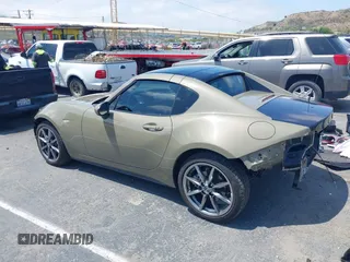 2023 Mazda MX-5 Miata Grand Touring z VIN JM1NDAM73P0561844, wystawiony jako IAAI lot #42195198 z przebiegiem 6 020 mil mil oraz . Historia ofert i sprzedaży dostępna na DreamBid. Obrazek 3.