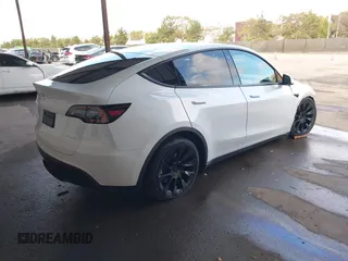 2023 Tesla Model Y Long Range with VIN 7SAYGAEE0PF787216, listed as a IAAI auction lot 41589954 with 17,985 mi miles and . Bid and sale history available at DreamBid. Image 4.
