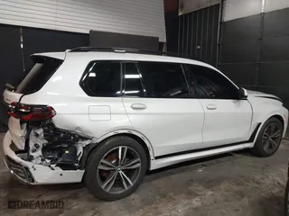 2023 BMW X7 xDrive40i with VIN 5UX23EM04P9P96036, listed as a IAAI auction lot 41235512 with 35,661 mi miles. Bid and sale history available at carsss.com. Image 14.