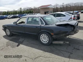 2002 Jaguar XJ 8 with VIN SAJDA14C62LF40435, listed as a Copart auction lot 52022645 with 153,703 mi miles and Salvage title. Bid and sale history available at DreamBid. Image 2.