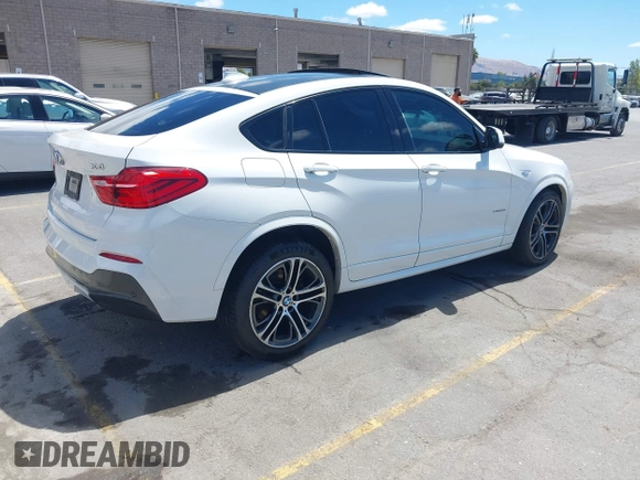 2015 BMW X4 xDrive28i with VIN 5UXXW3C5XF0M89147, listed as a IAAI auction lot 42779290 with 120,773 mi miles and . Bid and sale history available at DreamBid. Image 4.