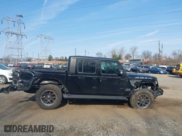 2021 Jeep Gladiator Overland z VIN 1C6HJTFG1ML606215, wystawiony jako IAAI lot #41771646 z przebiegiem 77 411 mil mil oraz . Historia ofert i sprzedaży dostępna na DreamBid. Obrazek 13.