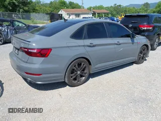 2021 Volkswagen Jetta GLI S z VIN 3VW6T7BU9MM052902, wystawiony jako IAAI lot #42286711 z przebiegiem 91 519 mil mil oraz . Historia ofert i sprzedaży dostępna na DreamBid. Obrazek 4.