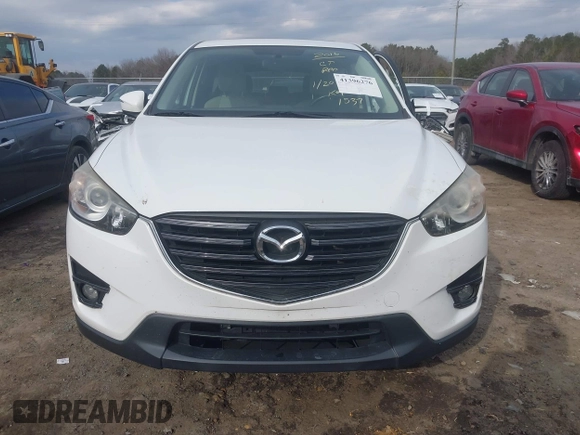 2016 Mazda CX-5 Touring with VIN JM3KE2CY5G0791537, listed as a IAAI auction lot 41396276 with 42,095 mi miles. Bid and sale history available at carsss.com. Image 13.