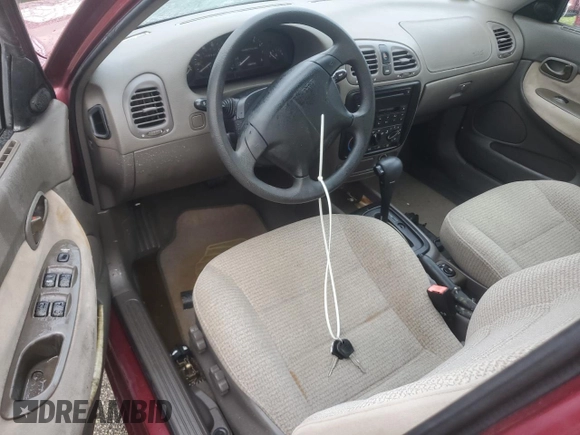 1999 Daewoo Nubira CDX z VIN KLAJB52Z5XK256700, wystawiony jako Copart lot #75085934 z przebiegiem Nie podano mil oraz Szkody całkowita. Historia ofert i sprzedaży dostępna na DreamBid. Obrazek 8.