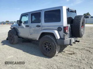 2014 Jeep Wrangler Unlimited Sahara with VIN 1C4HJWEG1EL126611, listed as a Copart auction lot 57169485 with 122,000 mi miles and Salvage title. Bid and sale history available at DreamBid. Image 2.