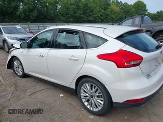 2015 Ford Focus Titanium with VIN 1FADP3N22FL365477, listed as a IAAI auction lot 37461727 with Not provided miles and . Bid and sale history available at DreamBid. Image 3.