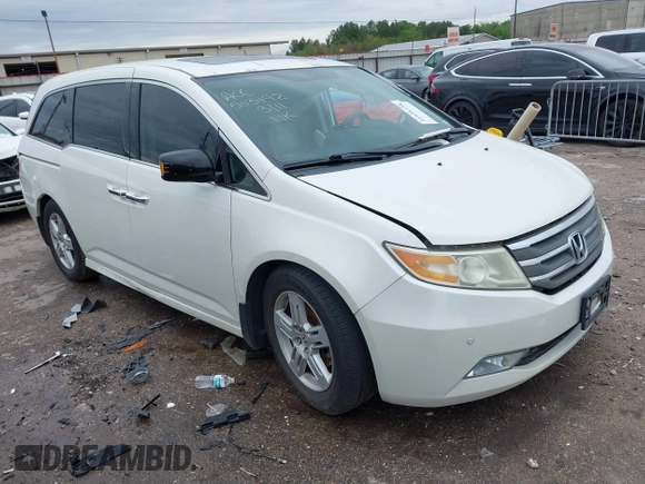 2013 Honda Odyssey Touring with VIN 5FNRL5H96DB074819, listed as a IAAI auction lot 41898358 with 123,428 mi miles and . Bid and sale history available at carsss.com. Image 1.