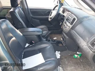 2003 Mazda Tribute ES with VIN 4F2CZ96133KM29066, listed as a IAAI auction lot 41581210 with 265,586 mi miles. Bid and sale history available at carsss.com. Image 5.