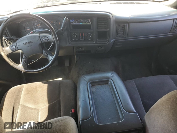 2006 GMC Sierra 1500 SLT z VIN 1GTEK19B36Z258351, wystawiony jako Copart lot #60077965 z przebiegiem 334 910 mil mil oraz Czysty tytuł • Clean title. Historia ofert i sprzedaży dostępna na DreamBid. Obrazek 8.