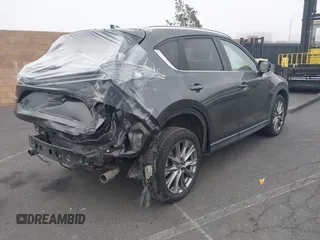 2021 Mazda CX-5 Grand Touring with VIN JM3KFADM2M1340669, listed as a IAAI auction lot 41916687 with 83,872 mi miles. Bid and sale history available at carsss.com. Image 4.