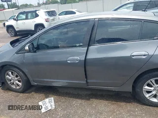 2010 Honda Insight EX z VIN JHMZE2H72AS023404, wystawiony jako IAAI lot #42505042 z przebiegiem Nie podano mil oraz . Historia ofert i sprzedaży dostępna na DreamBid. Obrazek 13.