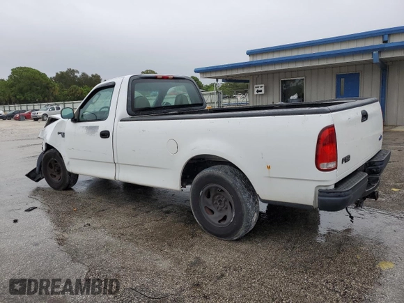 2002 Ford F-150 XL with VIN 1FTRF17W32NB86385, listed as a Copart auction lot 73276754 with 100,817 mi miles and Salvage Title. Bid and sale history available at carsss.com. Image 2.