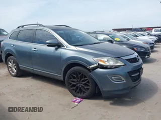 2011 Mazda CX-9 Grand Touring z VIN JM3TB2DA3B0322034, wystawiony jako IAAI lot #42247358 z przebiegiem 138 710 mil mil oraz . Historia ofert i sprzedaży dostępna na DreamBid. Obrazek 1.