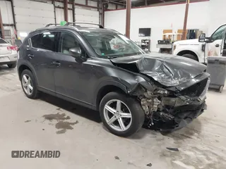 2020 Mazda CX-5 Grand Touring with VIN JM3KFBDM3L0739763, listed as a IAAI auction lot 41751250 with 88,063 mi miles and . Bid and sale history available at carsss.com. Image 1.