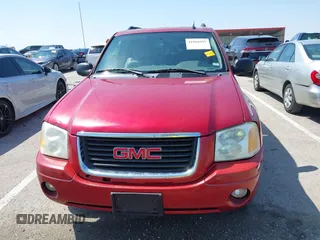 2005 GMC Envoy SLT with VIN 1GKDS13SX52144959, listed as a IAAI auction lot 41968495 with 238,199 mi miles. Bid and sale history available at carsss.com. Image 12.