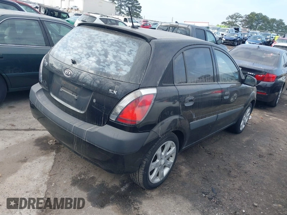 2009 Kia Rio LX with VIN KNADE243296481394, listed as a IAAI auction lot 41498863 with 59,222 mi miles. Bid and sale history available at carsss.com. Image 4.