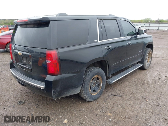 2016 Chevrolet Tahoe LTZ with VIN 1GNSKCKC7GR171904, listed as a IAAI auction lot 41967060 with 223,334 mi miles and . Bid and sale history available at DreamBid. Image 4.