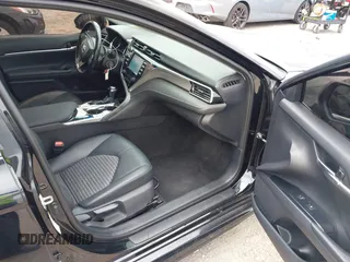 2018 Toyota Camry LE z VIN 4T1B11HK6JU158382, wystawiony jako IAAI lot #42185532 z przebiegiem 94 802 mil mil oraz . Historia ofert i sprzedaży dostępna na DreamBid. Obrazek 5.