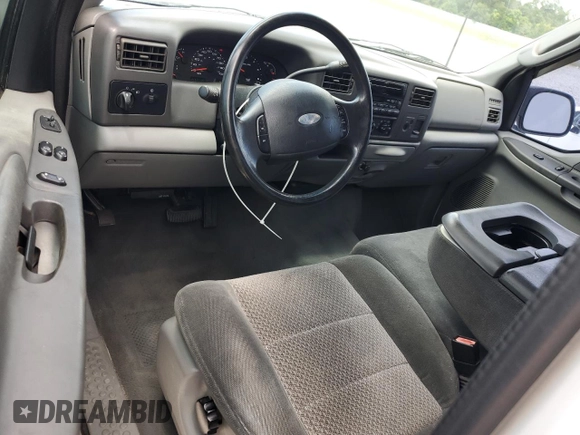 2003 Ford F-250 XL with VIN 1FTNX20L63EB37975, listed as a Copart auction lot 65723935 with 157,377 mi miles and Salvage title. Bid and sale history available at DreamBid. Image 8.
