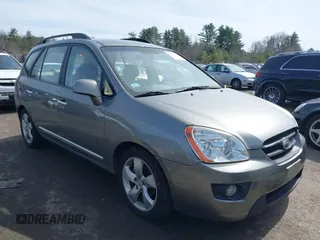 2009 Kia Rondo LX with VIN KNAFG526697274941, listed as a IAAI auction lot 41964802 with 180,941 mi miles. Bid and sale history available at carsss.com. Image 1.