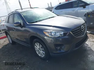 2016 Mazda CX-5 Touring with VIN JM3KE4CY9G0915305, listed as a IAAI auction lot 41840519 with 188,702 mi miles and . Bid and sale history available at carsss.com. Image 1.