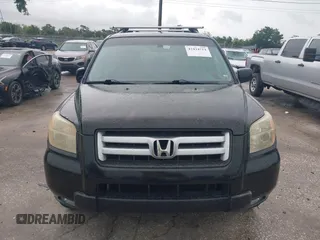 2007 Honda Pilot EX-L with VIN 5FNYF28577B028130, listed as a IAAI auction lot 42434714 with 179,299 mi miles and . Bid and sale history available at DreamBid. Image 12.