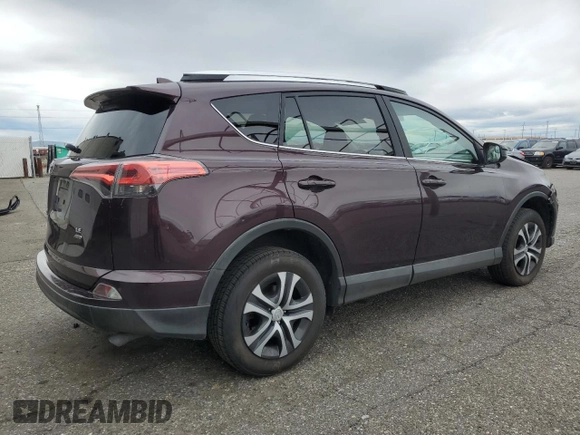 2016 Toyota RAV4 LE with VIN 2T3BFREV3GW490181, listed as a Copart auction lot 52457435 with 128,267 mi miles and Salvage Title. Bid and sale history available at DreamBid. Image 3.