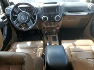 2011 Jeep Wrangler Unlimited Rubicon with VIN 1J4BA6H16BL561658, listed as a Copart auction lot 58379755 with 103,587 mi miles and Salvage title. Bid and sale history available at DreamBid. Image 8.