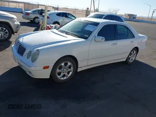 2002 Mercedes-Benz E-Class with VIN WDBJF65J22B455901, listed as a IAAI auction lot 41679008 with 153,854 mi miles. Bid and sale history available at carsss.com. Image 2.