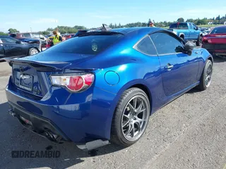2013 Scion FR-S with VIN JF1ZNAA11D2702415, listed as a IAAI auction lot 40381041 with 63,581 mi miles. Bid and sale history available at carsss.com. Image 4.