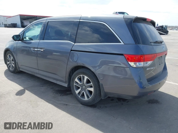 2014 Honda Odyssey Touring with VIN 5FNRL5H91EB093540, listed as a IAAI auction lot 41887412 with 202,076 mi miles and . Bid and sale history available at DreamBid. Image 3.