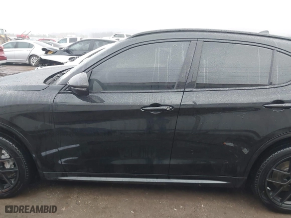 2021 Alfa Romeo Stelvio Ti with VIN ZASPAKBN0M7D02795, listed as a IAAI auction lot 41052309 with 83,584 mi miles. Bid and sale history available at carsss.com. Image 15.