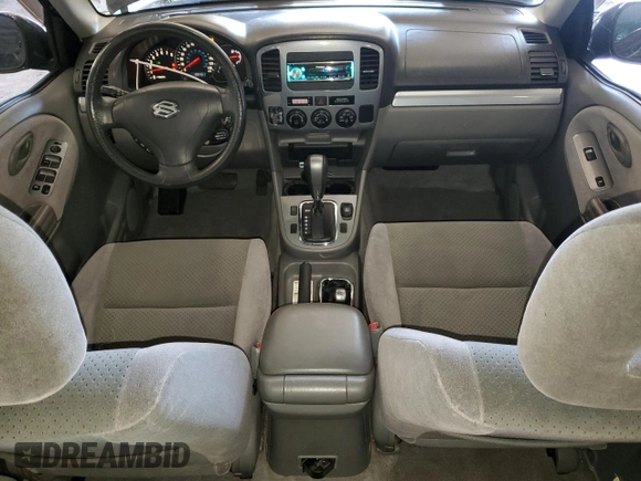 2003 Suzuki Grand Vitara z VIN JS3TD62V234100175, wystawiony jako Copart lot #47174605 z przebiegiem 88 451 mil mil oraz Szkody całkowita. Historia ofert i sprzedaży dostępna na DreamBid. Obrazek 8.