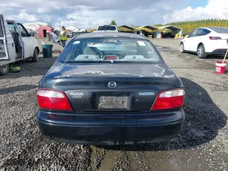 2000 Mazda 626 LX with VIN 1YVGF22CXY5123930, listed as a IAAI auction lot 40712369 with 210,234 mi miles. Bid and sale history available at carsss.com. Image 16.