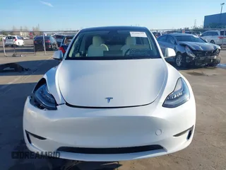 2021 Tesla Model Y Standard Range z VIN 5YJYGDED4MF123311, wystawiony jako IAAI lot #41200519 z przebiegiem 70 190 mil mil oraz . Historia ofert i sprzedaży dostępna na DreamBid. Obrazek 12.
