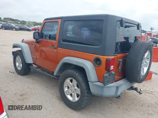 2011 Jeep Wrangler Sport with VIN 1J4AA2D1XBL579882, listed as a IAAI auction lot 42122353 with 153,885 mi miles and . Bid and sale history available at carsss.com. Image 3.