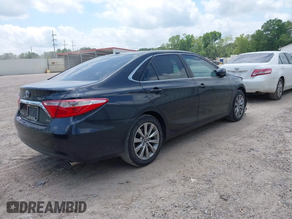 2015 Toyota Camry XLE with VIN 4T1BF1FKXFU881017, listed as a IAAI auction lot 42054825 with 122,232 mi miles and . Bid and sale history available at DreamBid. Image 4.