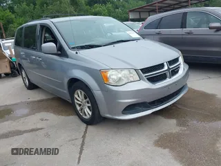 2014 Dodge Grand Caravan SXT z VIN 2C4RDGCG7ER212419, wystawiony jako IAAI lot #42272015 z przebiegiem 175 801 mil mil oraz . Historia ofert i sprzedaży dostępna na DreamBid. Obrazek 1.