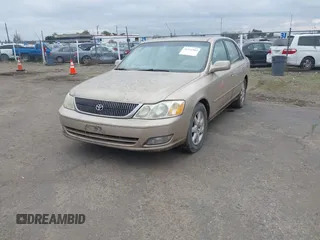 2001 Toyota Avalon XL w/Bucket Seats with VIN 4T1BF28B91U173868, listed as a IAAI auction lot 41721904 with 325,097 mi miles. Bid and sale history available at carsss.com. Image 2.