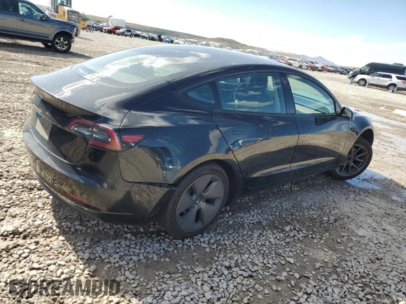2023 Tesla Model 3 with VIN 5YJ3E1EAXPF708001, listed as a Copart auction lot 57252735 with 71,579 mi miles and Salvage title. Bid and sale history available at DreamBid. Image 3.