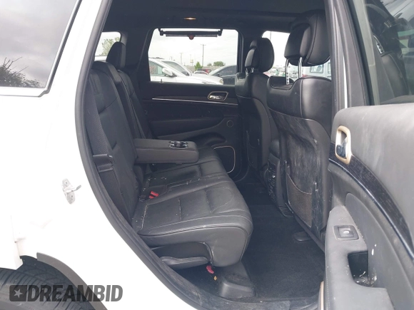 2014 Jeep Grand Cherokee Summit z VIN 1C4RJFJG2EC476114, wystawiony jako IAAI lot #42249108 z przebiegiem 97 569 mil mil oraz . Historia ofert i sprzedaży dostępna na DreamBid. Obrazek 8.
